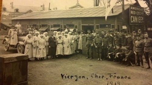 Black and white group photograph taken outside a Red Cross hut by Red Cross worker Julia Gray, 1919.